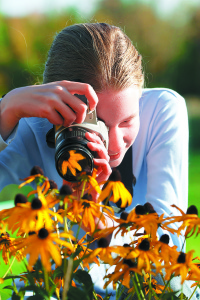 Girl taking photograph